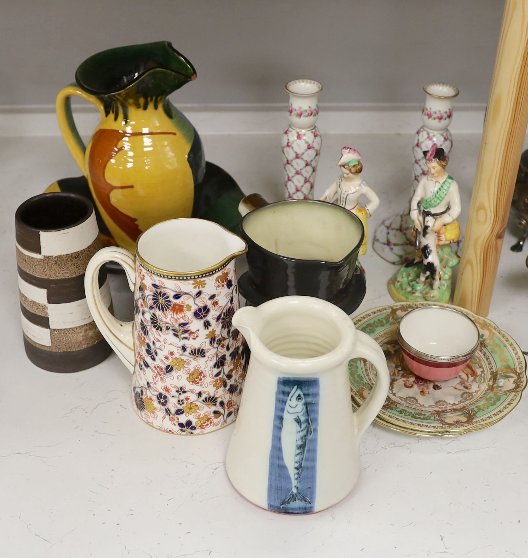 A pair of Dresden candlesticks, various art pottery jugs and a dish and other ceramics